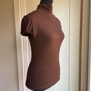 Fitted Short Sleeve Mock Turtle Neck with Gathered Shoulders.